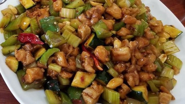 Kung Pao Chicken · Hot. Tender sautéed diced chicken with chili peppers, scallions and peanuts.
