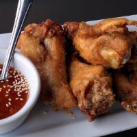 Chicken Wings · The wings are marinated from Thai region then deep fried to a golden brown. Served with a sw...