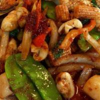 Fisherman'S Madness · Mixed seafood, snow peas, baby corns, onions, mushrooms, bell peppers and basil stir-fried i...