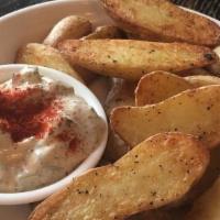 Salt-Roasted Fingerlings · Crispy fingerlings, potato salad aioli, smoked paprika.