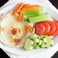 Hummus With Raw Vegetables · Garbanzo beans, garlic, tahini sauce topped with olive oil served with pita bread and raw ve...