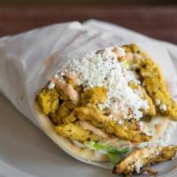 Traditional Chicken Gyro · Grilled chicken gyro meat served in a pita bread with tomatoes, pickles, lettuce and onions ...