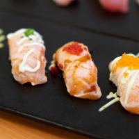 Seared Salmon Nigiri Combo (5) · Seared salmon, spicy mayo, wasabi aioli, unagi sauce, mayo blanc, omaki sauce.