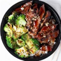 Beef & Broccoli Bowl · Wok stirred garlic and Sam's teriyaki sauce with steak and broccoli, served with steamed rice.