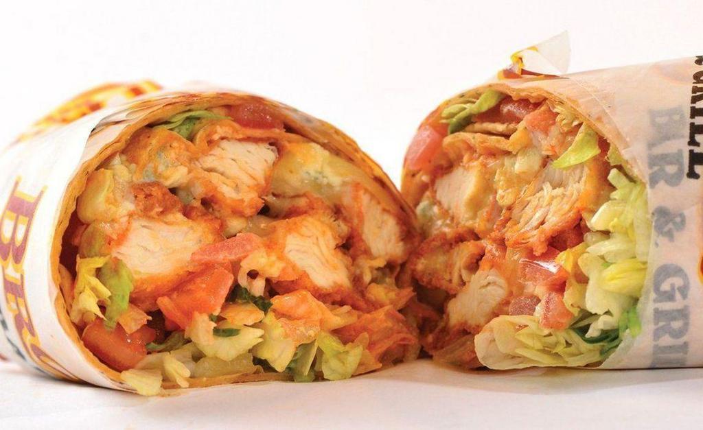 Buffalo Chicken Wrap · Hand-breaded and fried chicken breast tossed in our own buffalo sauce, served with provolone cheese, shredded lettuce, diced tomato, and bleu cheese crumbles in a tomato-basil flour tortilla wrap.