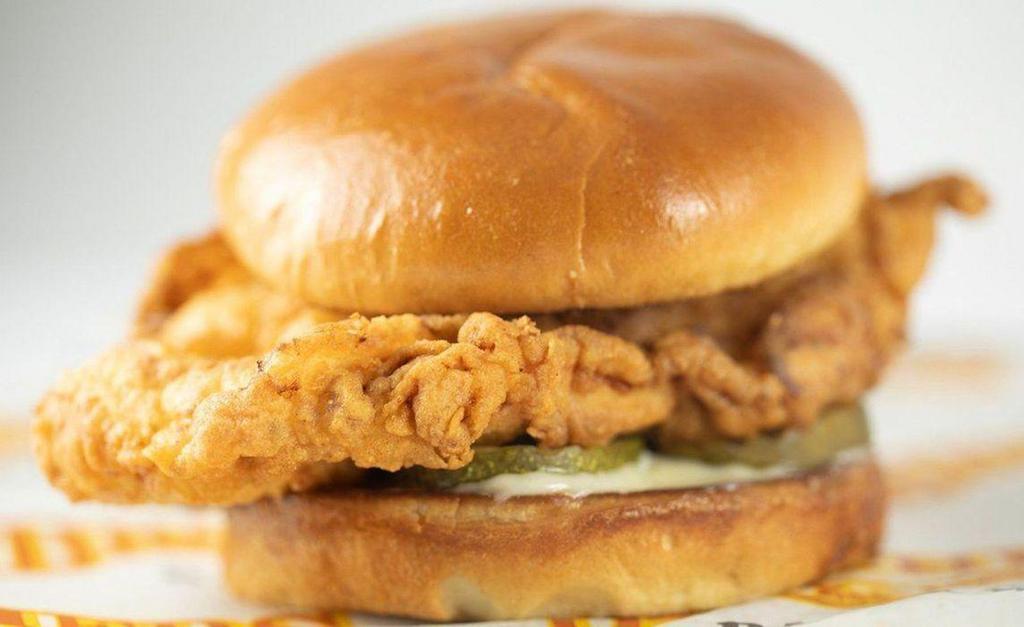 Brothers Classic Chicken Sandwich · Back to basics. Marinated chicken breast, hand-battered, fried with mayo and pickle on a toasted bun.