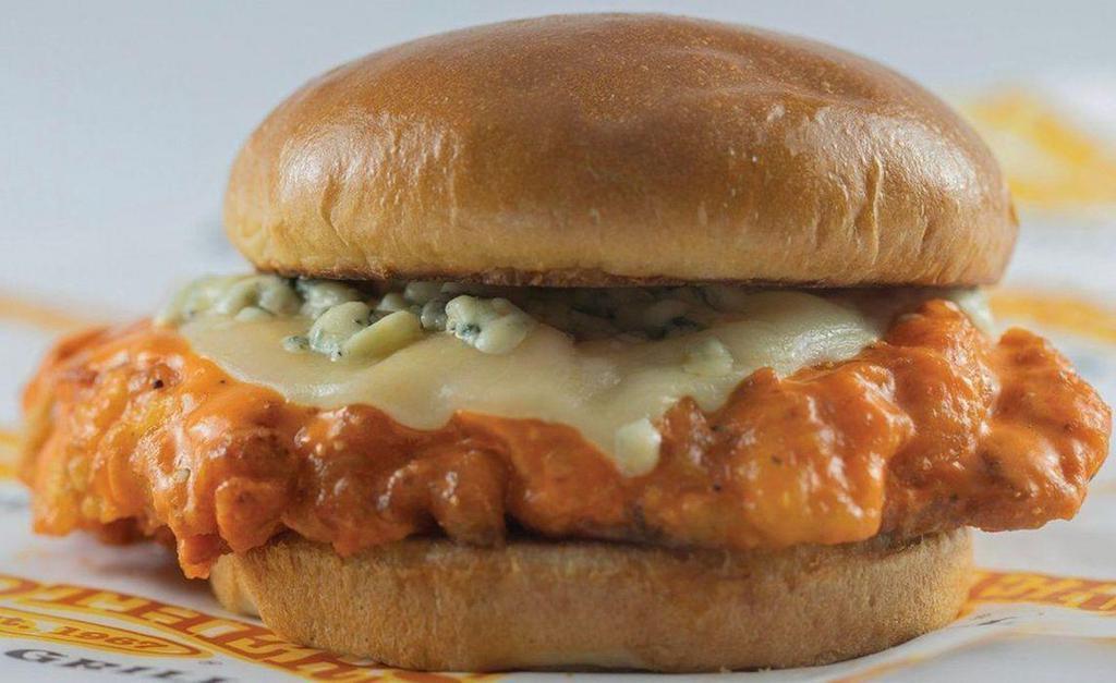 Buffalo Chicken Sandwich · Hand-breaded and fried chicken breast tossed in buffalo sauce, topped with provolone and bleu cheese crumbles served on a toasted bun.