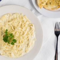 Fettuccine Alfredo · Fettuccine noodles topped with a rich alfredo sauce and a side of garlic toast. Add salmon o...