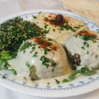Falafel · Ground garbanzo beans mixed with parsley, onions, garlic and spices. Topped with tahini sauce.