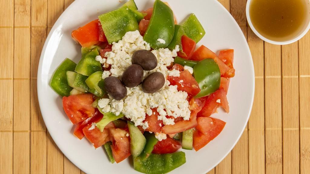 Greek Salad · Lettuce, tomato, cucumber; onion, Feta cheese, olives, peppers and Greek dressing.