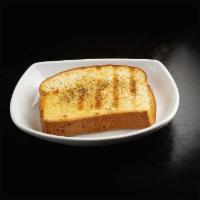 Grilled Garlic Toast · Thick-cut Texas toast, buttered and grilled, seasoned with a special garlic & herb blend