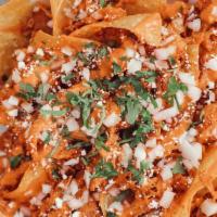 Chicken Tinga Chips · House Chips Smothered with Chicken Tinga, Onion, Cilantro, Cotija
