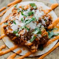 Chicken Tinga · Braised Chicken Thigh with Tomato and Chipotle, Guak, Onion, Cotija, Roasted Red Pepper Sauc...