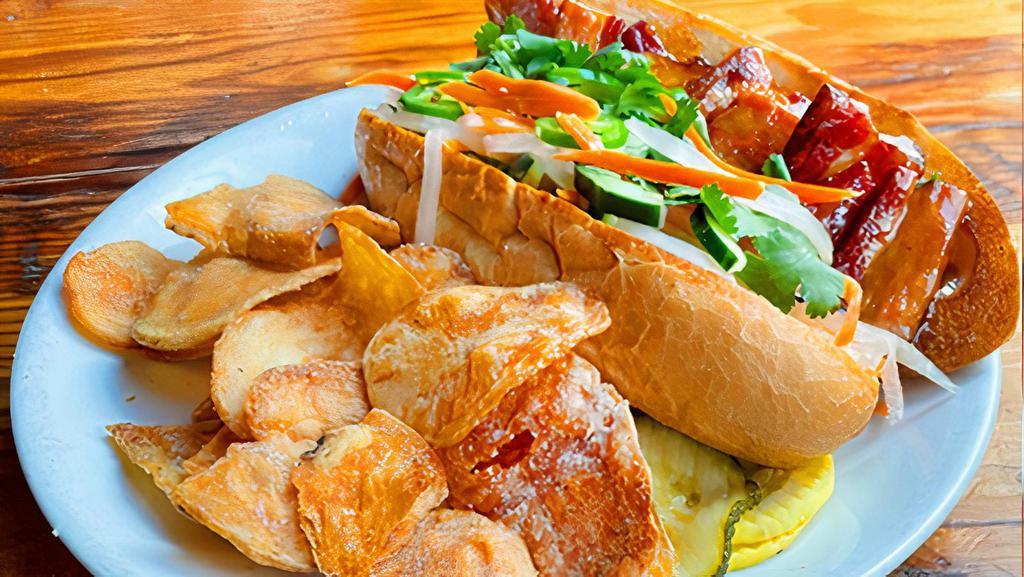 Pork Belly Bahn Mi · Ginger caramelized pork belly, daikon, carrot, cilantro, fresh jalapeño and sriracha veganaise on a French roll. Served with chips. Can be ordered as a salad.