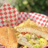 Chicken Sub · Chicken, Provolone, Banana Peppers, Lettuce, Red Onions, Tomatoes, Champagne Vinaigrette