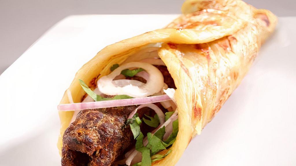 Kebab Wrap كباب صاج · , pickles onion lattes tomato and Hot sauce garlic sauce