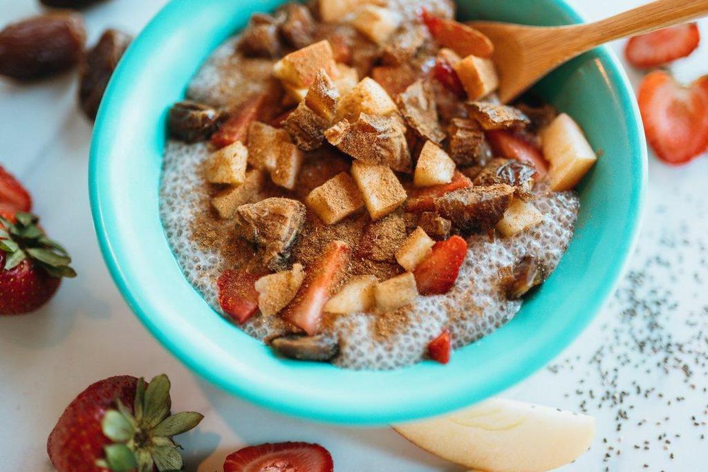 Cinnamon Chia Pudding Bowl · This protein-rich breakfast bowl is made with organic chia seeds soaked in fresh house-made Almond Milk, dates, banana, strawberries, apple, cinnamon, and trail mix (trail mix type varies, contains nuts). Hydrating and a great source of Omega-3 fiber, calcium, high-quality protein, and slowly-processed carbohydrates.