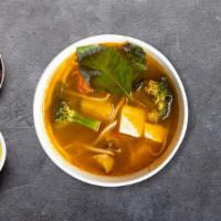 Veggie Soup · Non-spicy clear broth soup with tofu, carrots, Napa cabbage, baby corn, mushrooms, onion, ci...