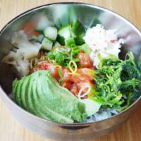 Yuzu Salmon · Yuzu chili, wakame salad, cucumber, crab salad, avocado, ginger, sushi rice or mixed greens....