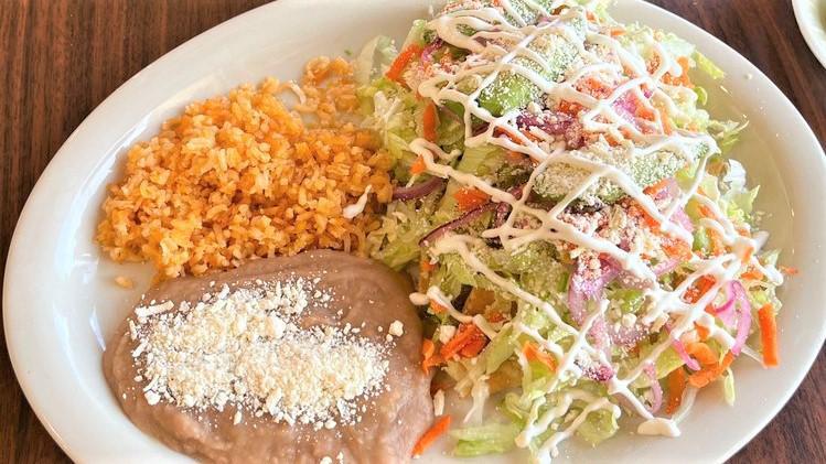 Tacos Dorados / Golden Brown Tacos · El plato viene con lechuga, zanahorias, cebollas moradas aguacate, queso, y un acompañante de arroz, frijoles. / The plate comes with lettuce, carrots, red onions, avocado, cheese, and a side of rice, beans.
