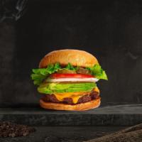 Avocado Avenue Vegan Burger · Impossible patty topped with avocado, melted vegan cheese, lettuce, tomato, onion, and pickl...