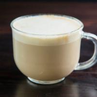Latte · Micro-foamed milk with capomo espresso.