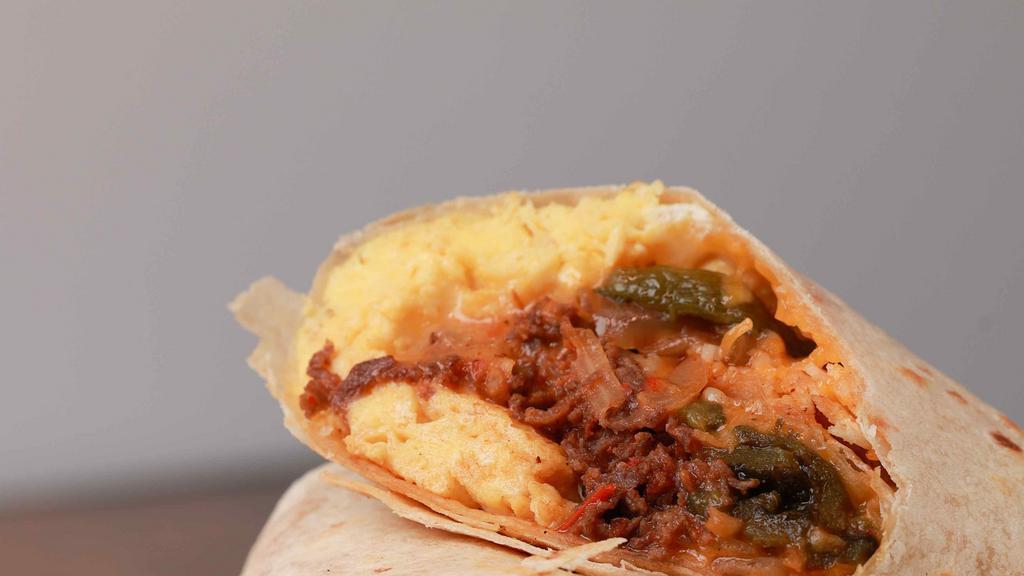 The Ct Cruuunch · Eggs, ribeye steak, sauteed onions, poblano peppers, mushrooms with a spicy salsa roja and shredded cheddar jack cheese rolled in a flour tortilla wrap. Served with hot sauce.