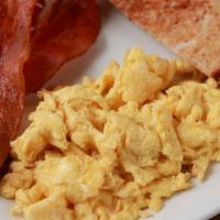 Bacon And Eggs · 3 scrambled eggs served with crispy bacon, tater tots, choice of buttered toast, side of hot...