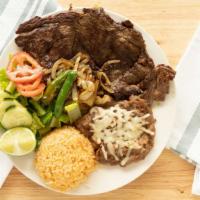 Carne Asada · Steak served with Rice, Beans, tomatoes, lime, onion and it's salsa aside.