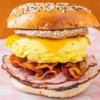 Sausage, Bacon, Ham, Egg & Cheese · Toasted bagel with ham, sausage, bacon egg and cheese.