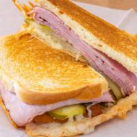 Cuban Grilled Cheese  · Double ham melted with Swiss cheese, Mayo, pickles on sourdough bread.
