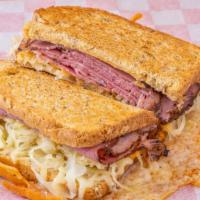 Reuben Grilled Cheese  · Double pastrami melted with Swiss cheese, sauerkraut, thousand island dressing on Dile Rye b...