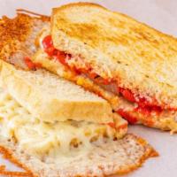 Gouda Grilled Cheese  · Gouda Cheese melted with Monterey Jack cheese, roasted red pepper and caramelized onion.