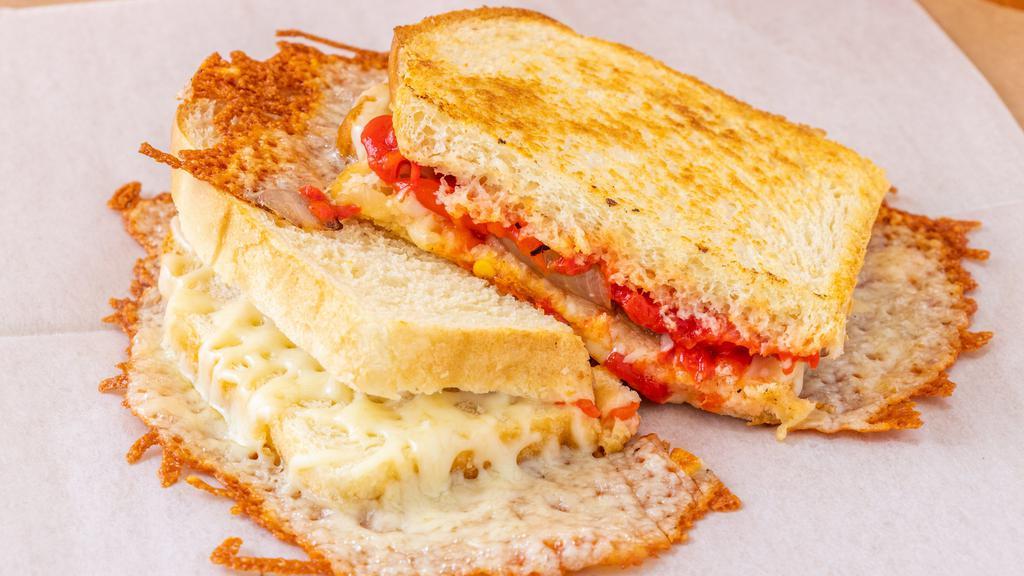Gouda Grilled Cheese  · Gouda Cheese melted with Monterey Jack cheese, roasted red pepper and caramelized onion.