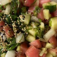 Hawaiian Classic · Ahi tuna, green onion, sweet onion, seaweed salad, cucumber, PokeCo sauce and sesame seeds