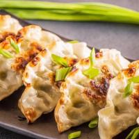 Gyoza · Flash-fried chicken and vegetable gyoza. Served with house special sauce.
