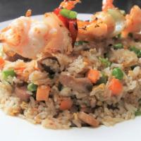 Fried Rice · Fried rice with peas and carrots and your choice of meat.