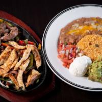 Fajitas · Sautéed onions and bell peppers with your choice of meat presented on a hot skillet. Served ...