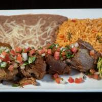 Carnitas Michoacan · Our pork is seared to give it a crisp outside and slow-cooked to tenderness heaven. Served w...