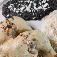 Pollo En Mole Verde · Contains Peanuts. Home-made mole verde is served over half a chicken then sprinkled with an ...