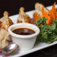 Pork & Ginger Pot Stickers (5 Pieces) 🌶 · Mild spicy. Pork, ginger, shiitake mushroom, water chestnut, and cabbage in delicious pot st...