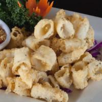 Fried Calamari · Tender calamari dusted in lightly seasoned rice flour and delicately fried. Complemented by ...
