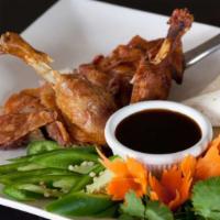 Crispy Duck · A half-duck roasted to a golden crisp and served with cilantro, green onion, jalapeño, a swe...