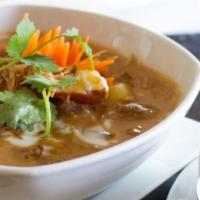 Massaman Beef Curry 🌶🌶 · Gluten-free, medium spicy. Slow braised beef chuck roast served in a light, coconut milk bas...
