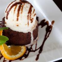 Molten Lava Chocolate Cake With Vanilla Bean Ice Cream · Warm, rich chocolate cake filled with molten chocolate; perfectly paired with a topping of v...