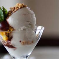 Homemade Coconut Ice Cream · Gluten-free. Made with luscious, fresh coconut milk; topped with chocolate syrup and crushed...