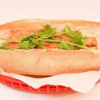 Sautéed Tofu Sandwich · French baguette, mayonnaise, carrot, daikon slaw, cilantro, jalapeño and house sauce.