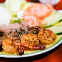 Com Dac Biet · Combination of char-broiled pork, char-broiled meatball and grilled shrimp.