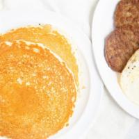 Flapjack Combo · Two large buttermilk cakes, two eggs and two sausage patties or three strips bacon served wi...