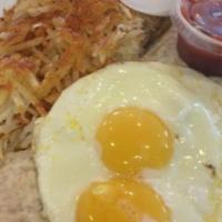 Huevos Rancheros · Flour tortilla smothered with chili con carne, cheese, salsa, sour cream, onions, tomatoes, ...